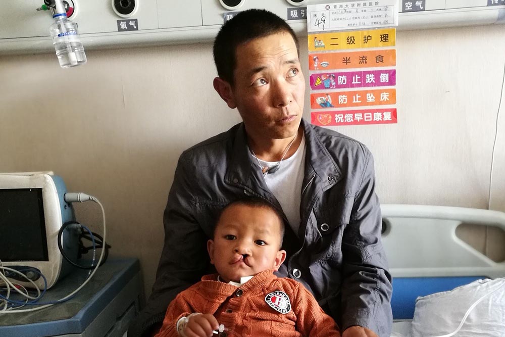 Bao in the hospital with his father