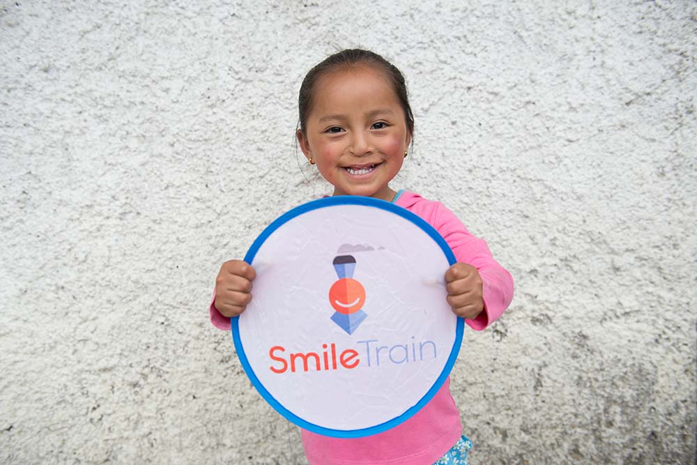 Fernanda with a smile train sign