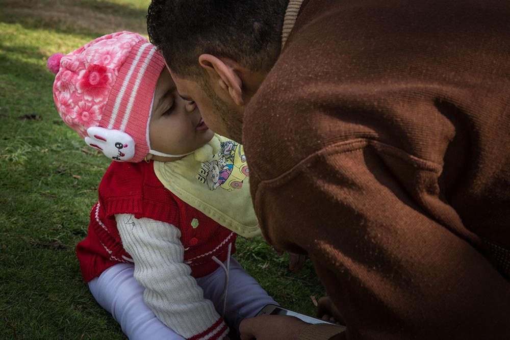 Habeeba presses forehead to father