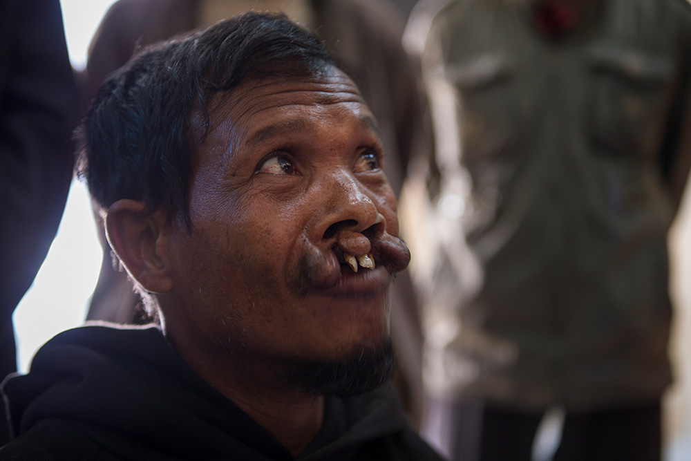 Mohammad sits at Refugee Camp