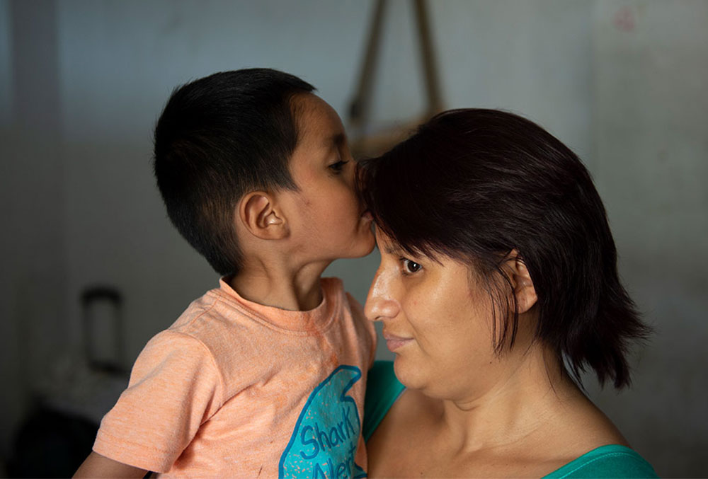 Anghelo kisses his mom