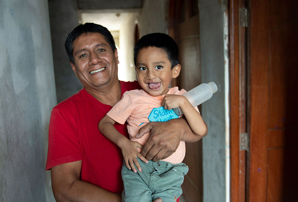 Anghelo with his dad smiles