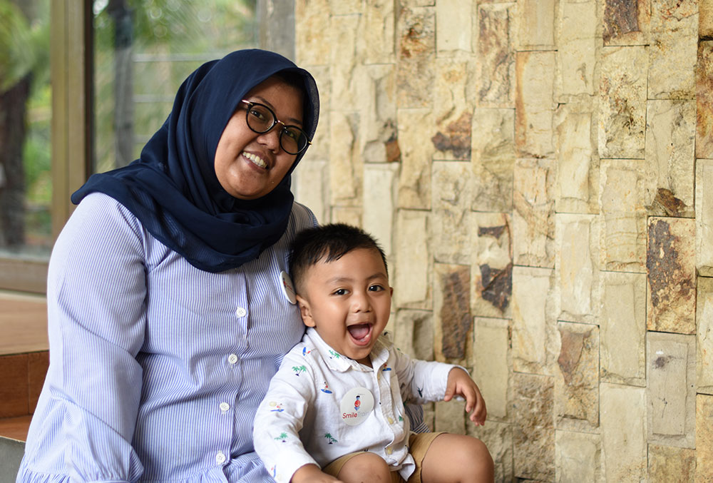 Windri with Biru after his cleft surgery