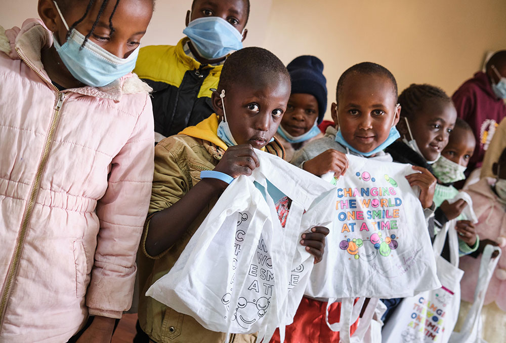 Patients of the HearSay & Read Clinic with their Smile Train goody bags