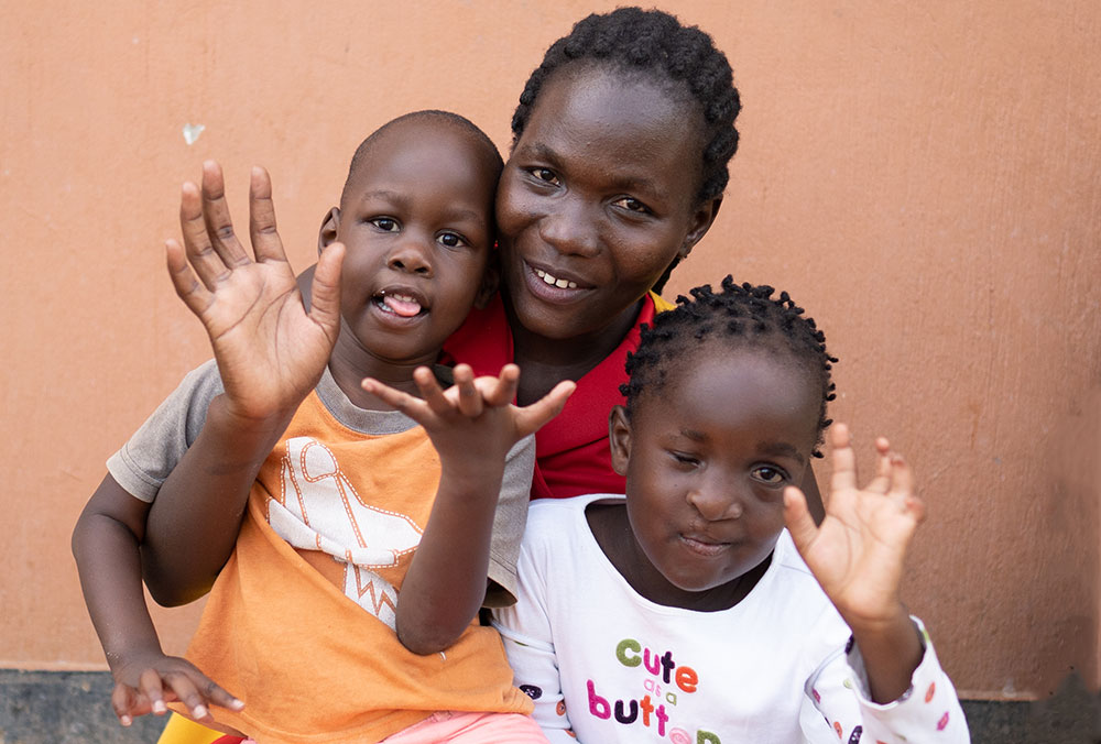 Miracle, at right, with her teacher and a classmate