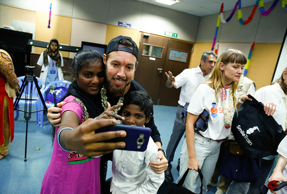 Troy visiting Smile Train patients in India