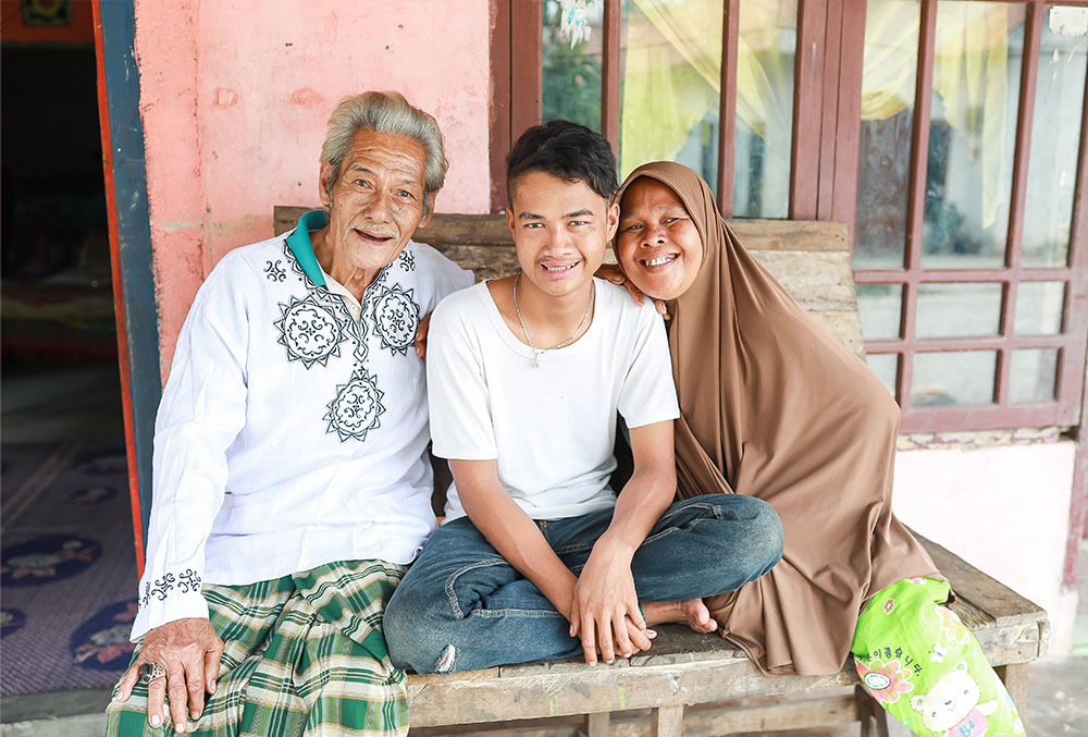 Angga with his parents after cleft surgery