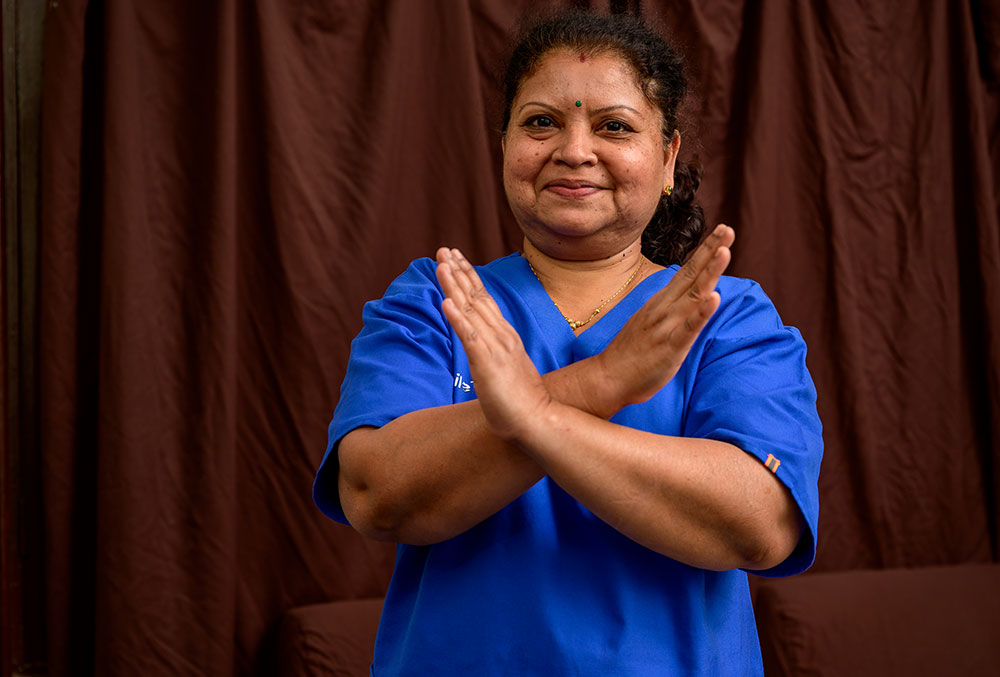 Dr Neela crossing her arms for International Women's Day 