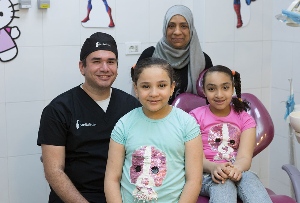 Sondos with her family and Dr. El Ghafour at Kids Hospital