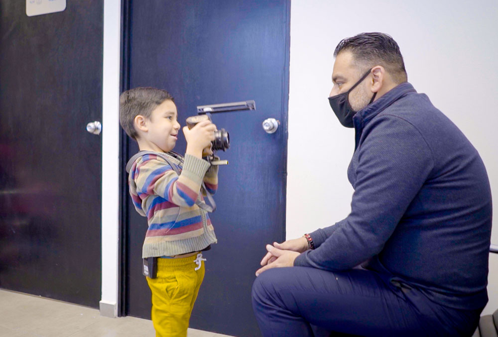 Damian interviews his dad for the camera