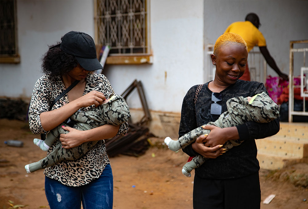 Audrey and Fabiola taking the twins to Yaoundé for their Smile Train-sponsored cleft surgery