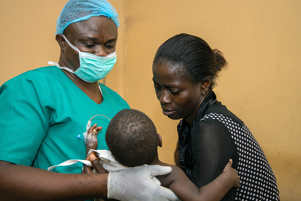 Ugwuoke, Immaculata, and a Smile Train staff member at the National Orthopaedic Center