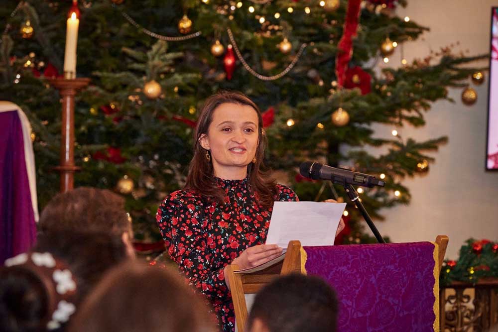 Beth Angella giving a speech at Grosvenor Chapel