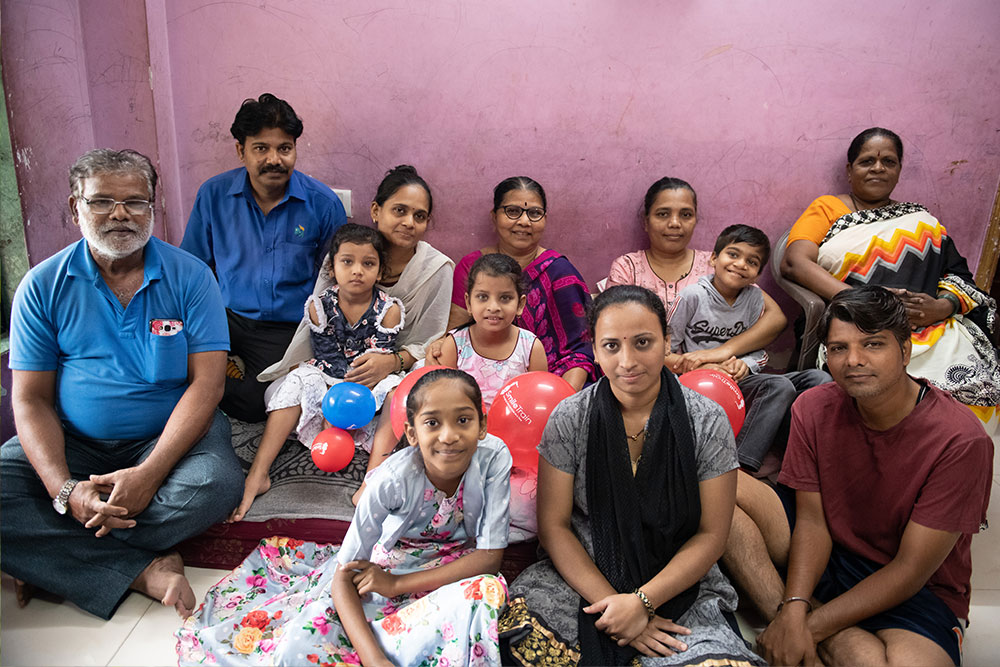 Samrat smiling with his extended family