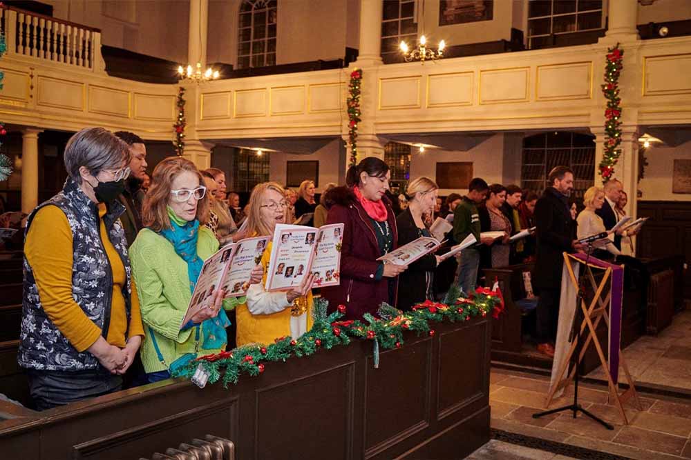 Smile Train UK supporters singing at Big Smile Carol Concert