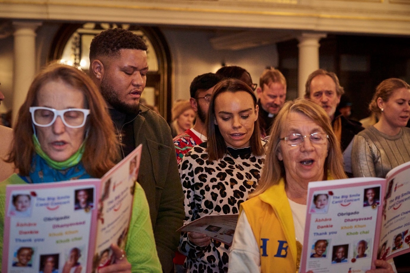 Smile Train UK supporters singing at Big Smile Carol Concert