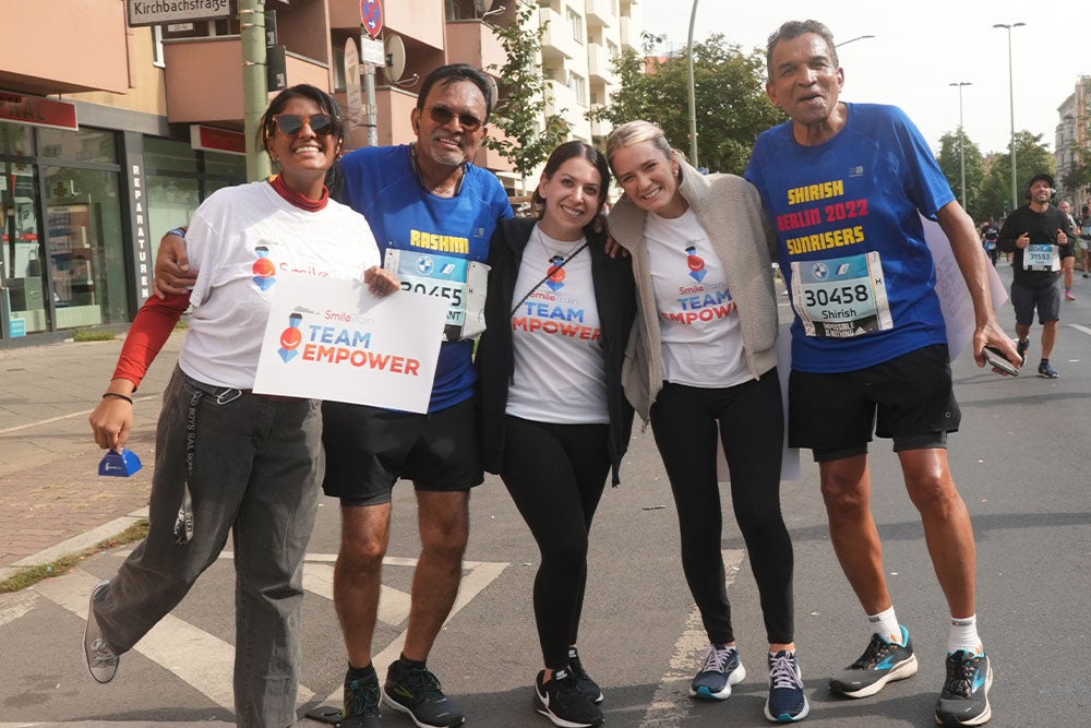 Runners from Kenya pose with Candace and Smile Train’s Associate, PR, Julia Heymann at the Berlin Marathon