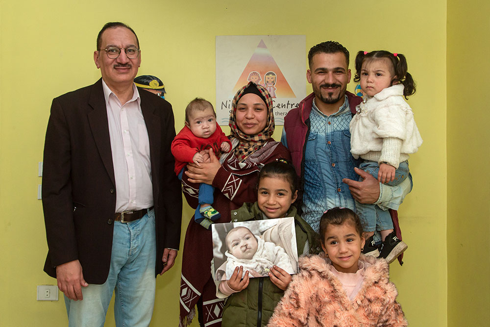 Mustafa with his parents and sisters and Dr Aboul Hassan