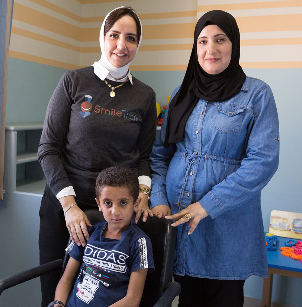 Dr Sally with a patient and his mother