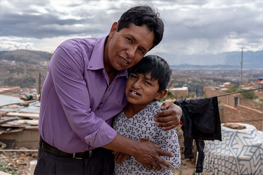 Luis and his father hugging