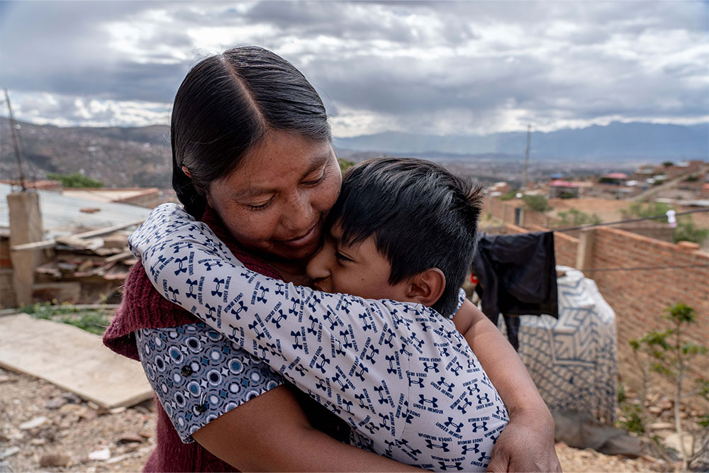 Luis and Elsa sharing a big hug