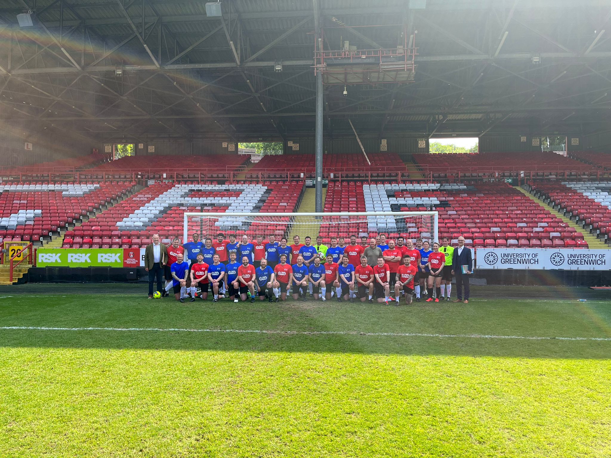 Players from the football fundraiser queueing up together