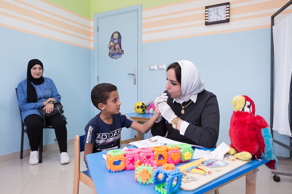 Fares at speech therapy with Dr Sally and Nadia