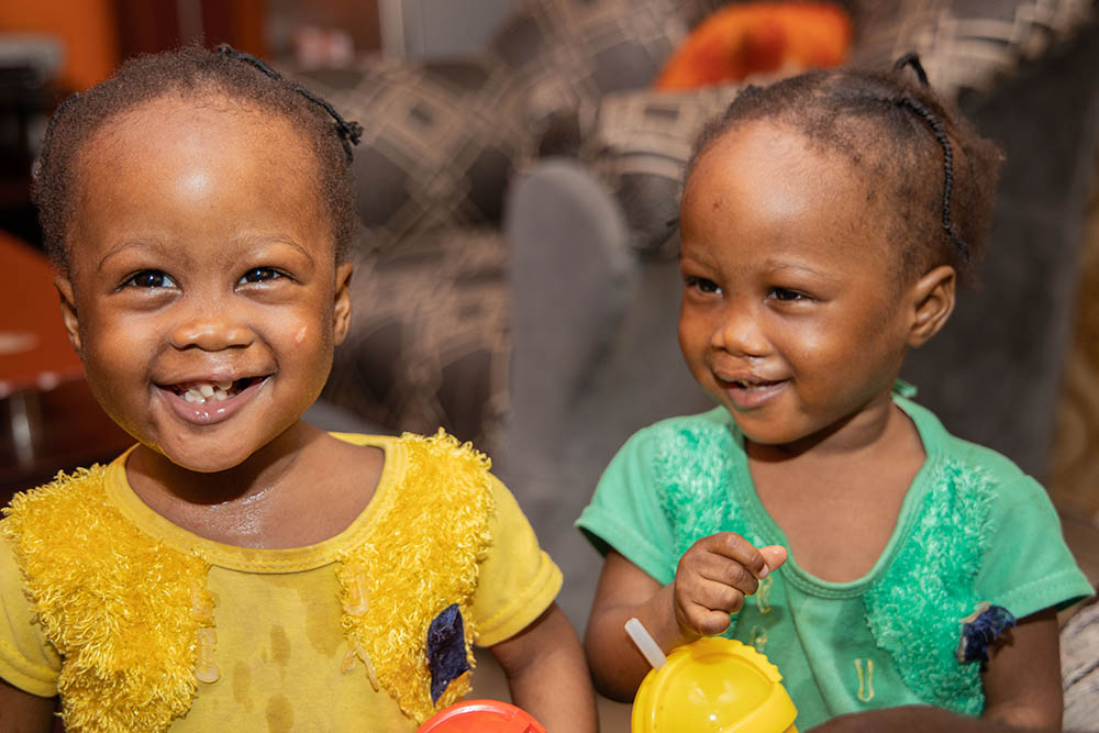 Twins Taiwo and Kehinde smiling after cleft surgery