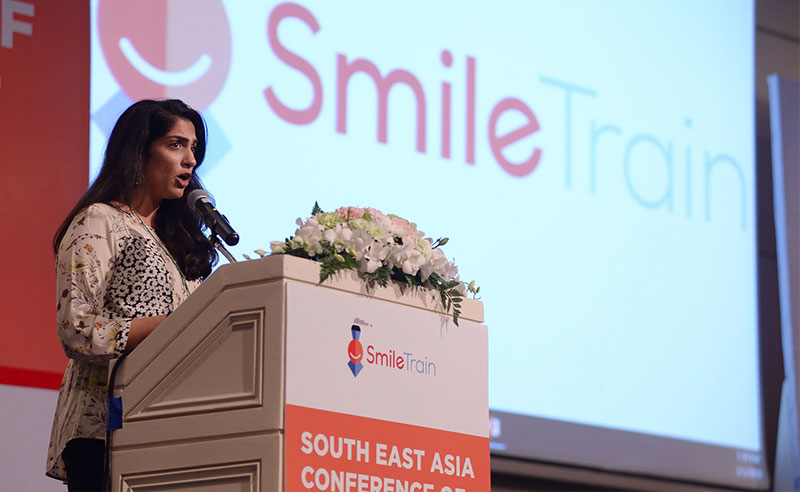 Priya speaking on behalf of Smile Train at a conference