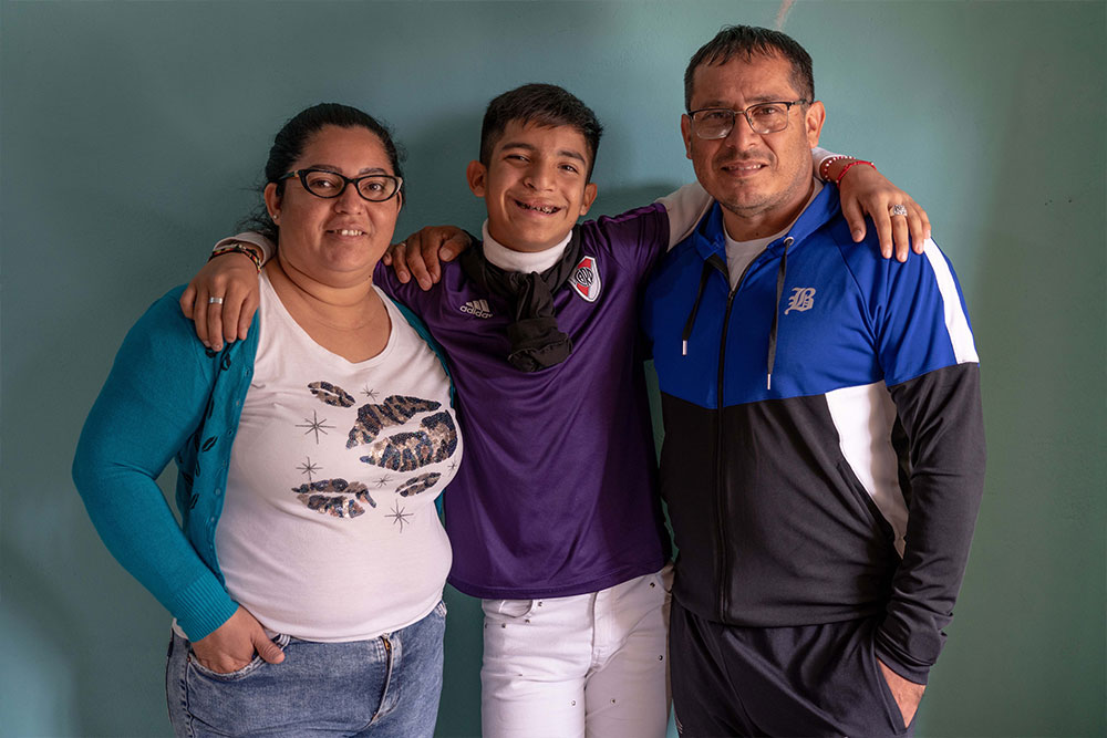 Bautista smiling with his parents