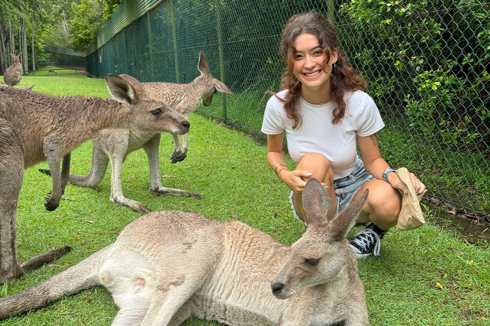 Georgina playing with kangaroos