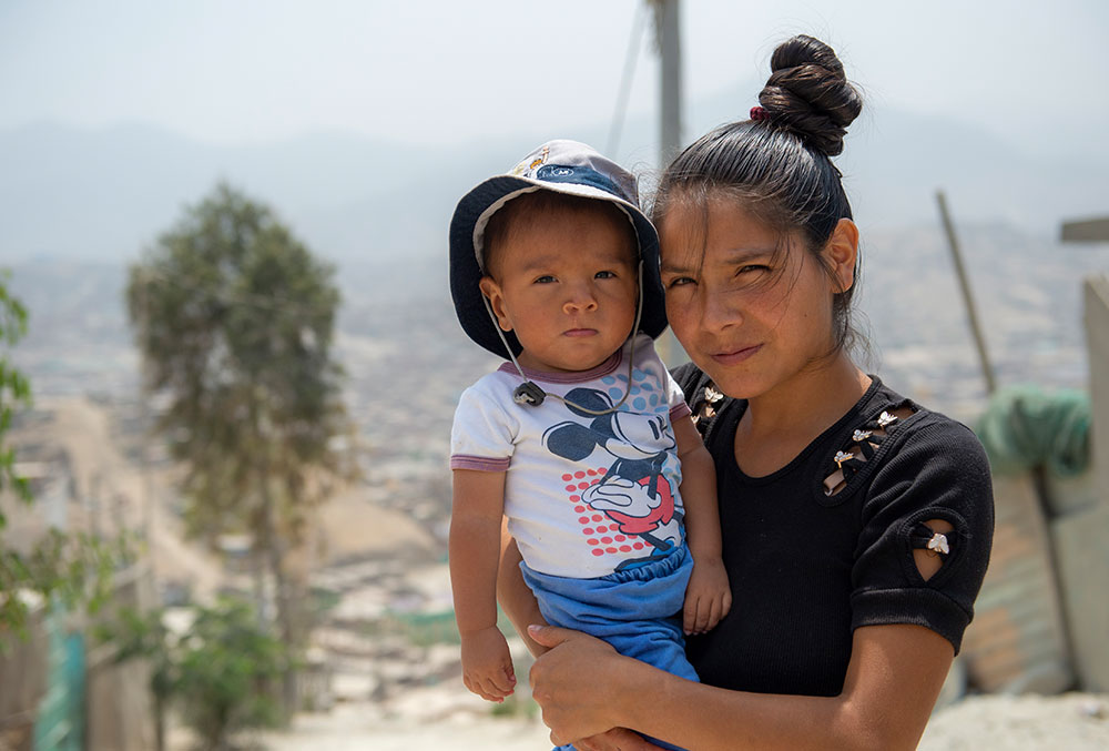 Zindia holding Joseyur after his Smile Train-sponsored cleft surgery