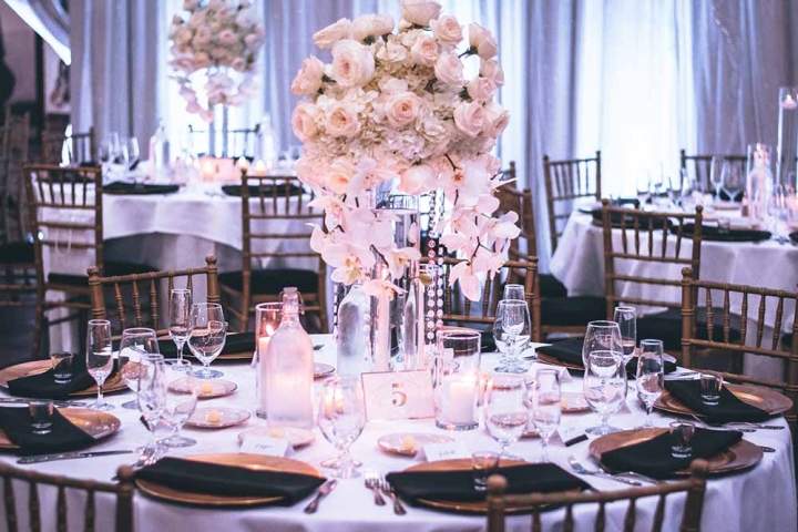 A wedding setting of plates and flowers