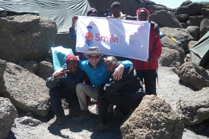 Steve Anthony representing Smile Train on the summit of Mt. Kilimanjaro 