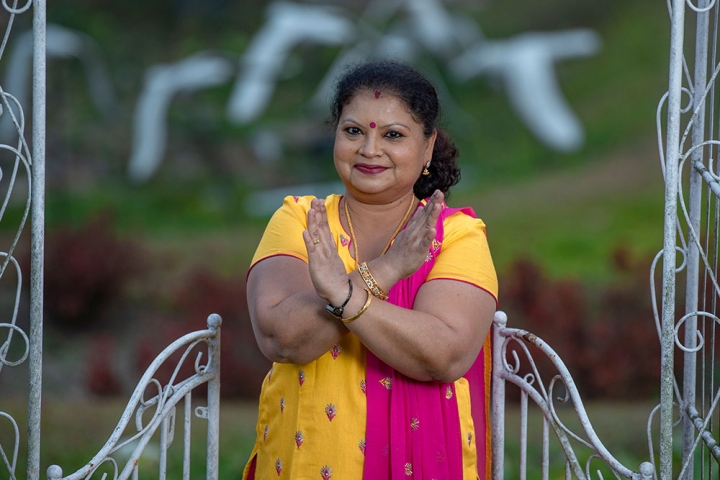 Dr Neela making the #BreakTheBias hand symbol for International Women's Day