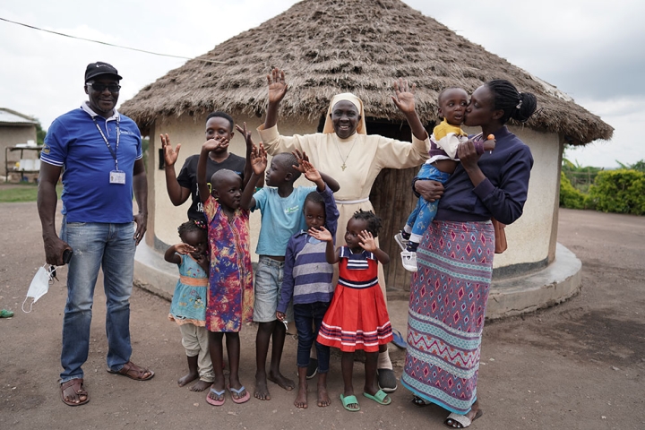 Sister Najjuka celebrates with a patient's family