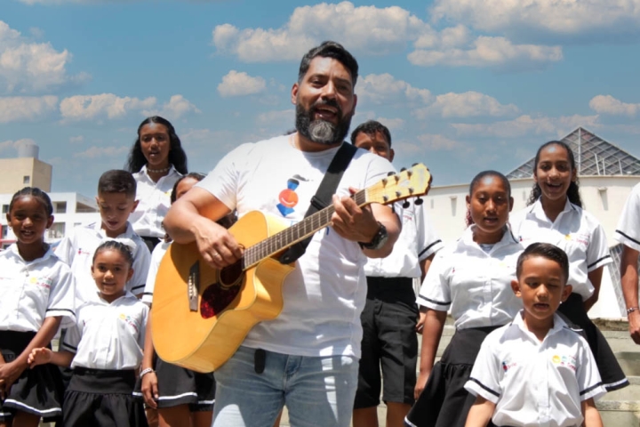 The cleft choir at Hospital Notti in Mendoza, Argentina, performing on a scenic riverbank