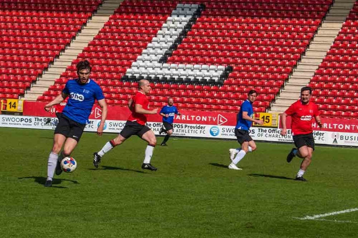 Two teams playing football on the field