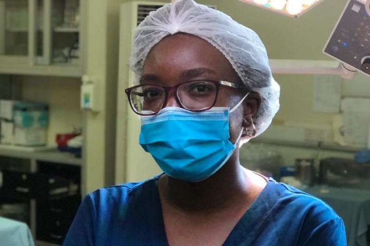 Dr Liz Igaga in scrubs and mask