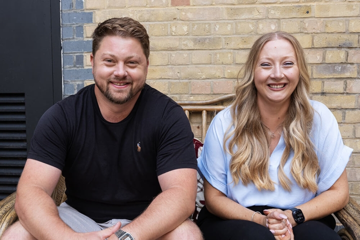 Olivia Whitbread smiling with her brother Adam