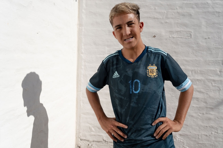 Federico smiling in a football jersey