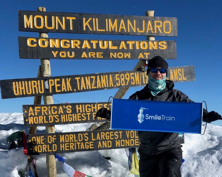 smile train supporter on top of Mount Kilimanjaro