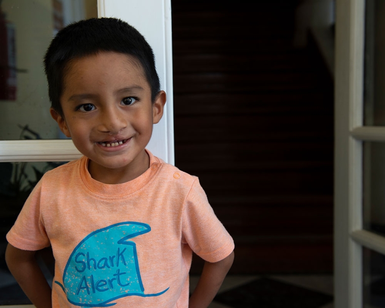 Anghelo smiles in shark shirt