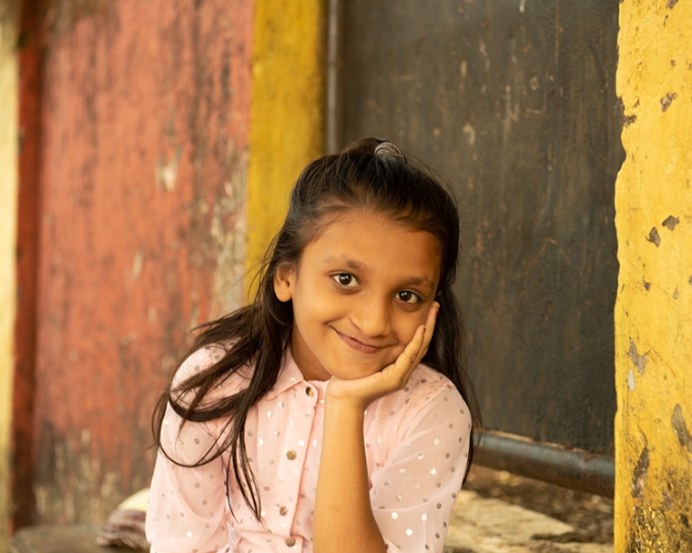 Humera smiling at camera