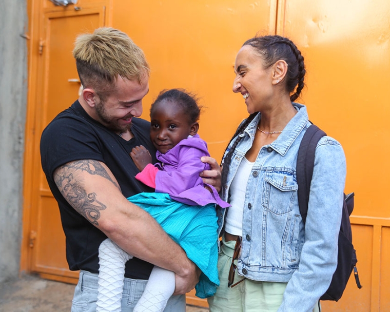 Smile Train UK ambassador hugs a Smile Train patient in Kenya