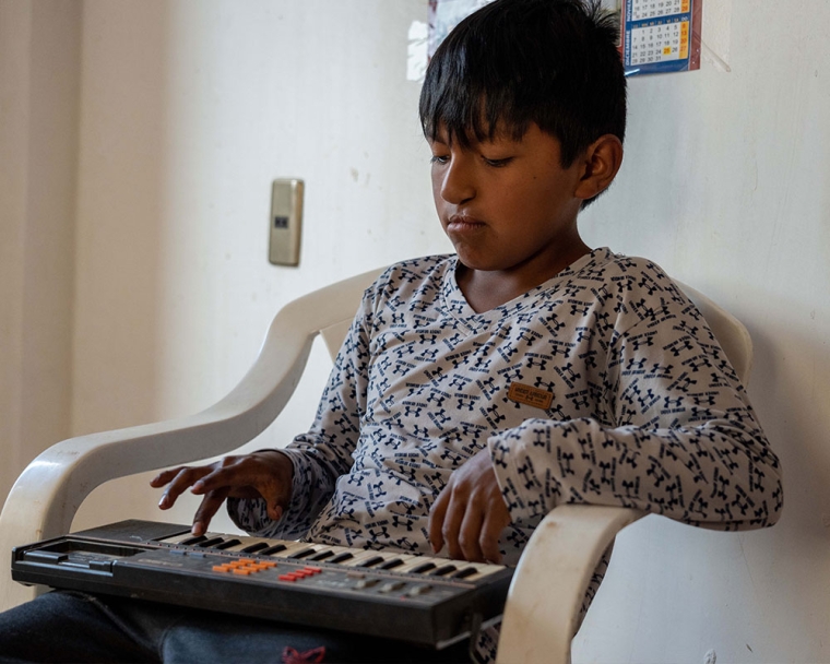 Luis playing a keyboard