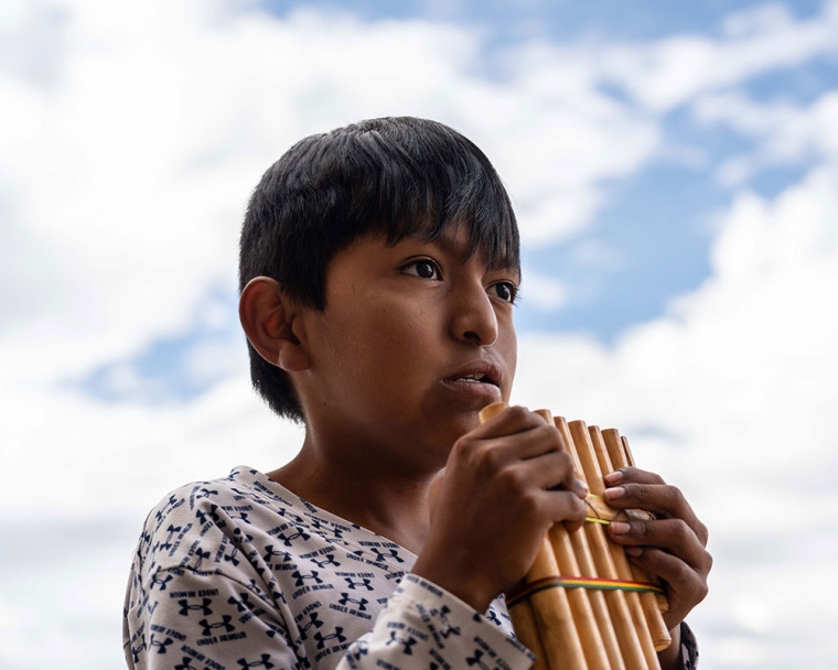 Luis playing a pan flute