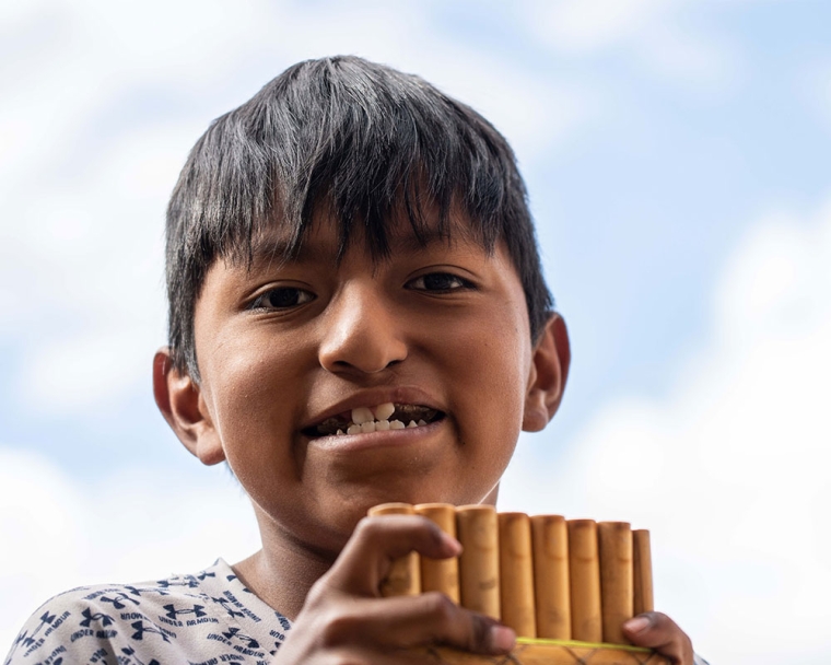 Luis playing a pan flute