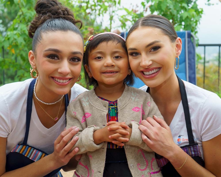 Miss Universe Organization smiling with Smile Train patients