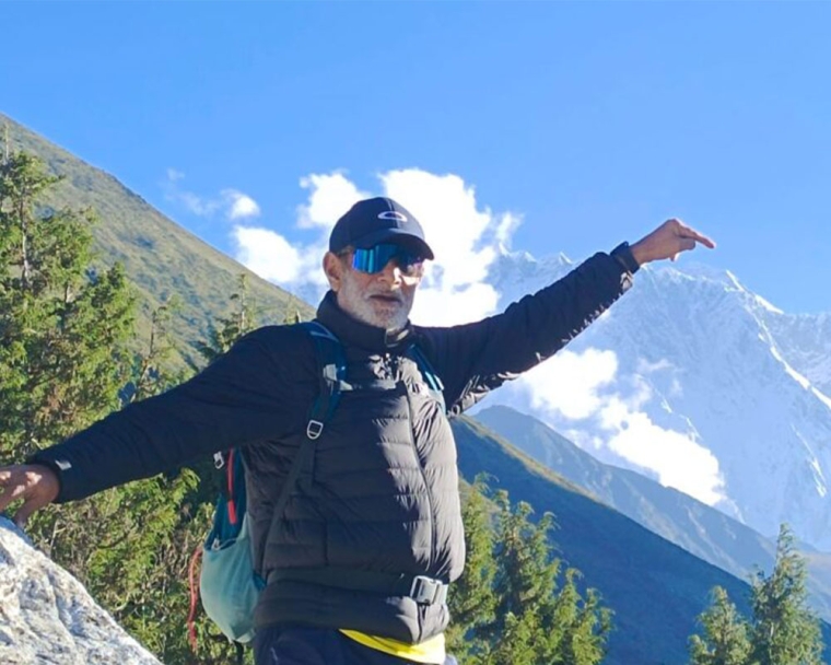 Sunil standing on a mountaintop